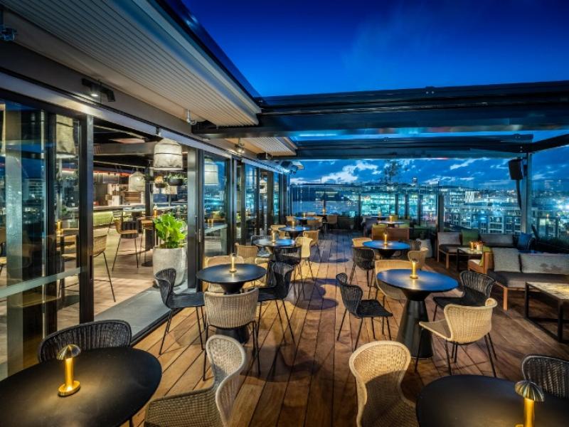 Outdoor seating QT Rooftop Bar