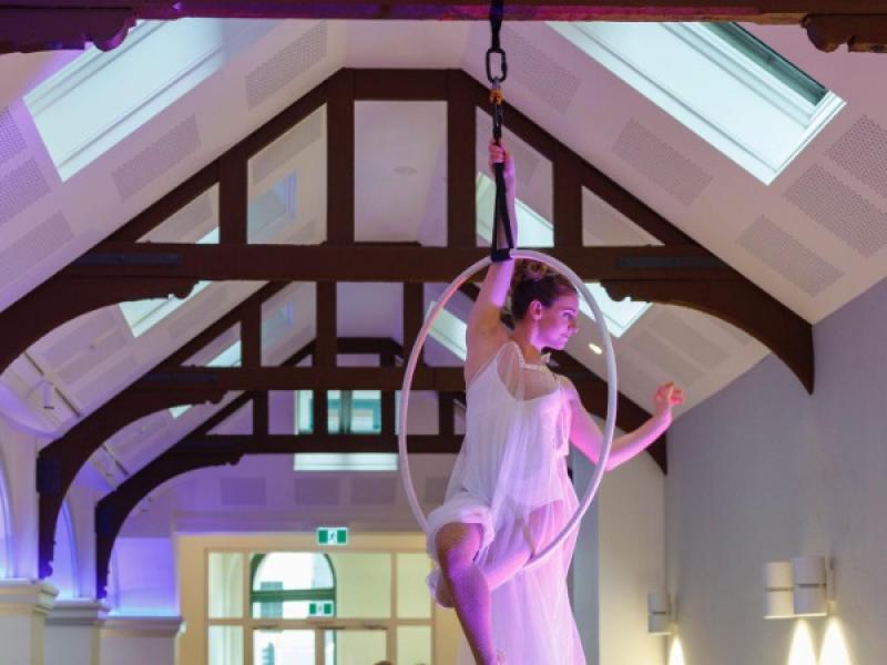 Acrobat in public trust hall